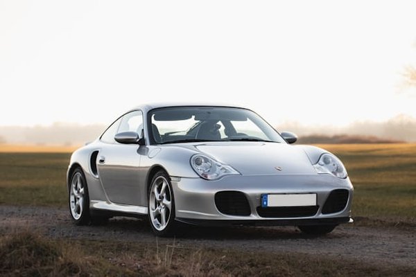 How Does the Porsche 911's Rear-Engine Layout Affect Its Driving Dynamics and Stability?